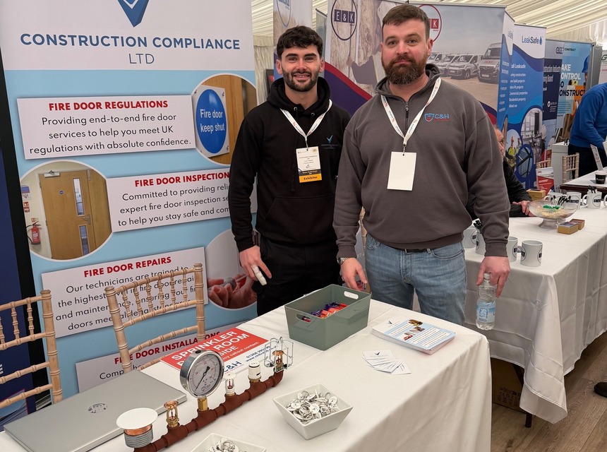 Engineer completing fire door inspection checks